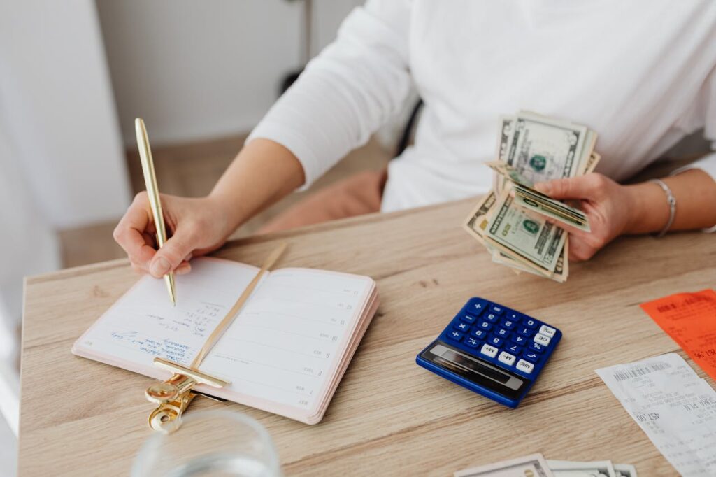 photo of a man tracking expenses, one of the 10 Life-Changing Hacks to Escape Being Broke